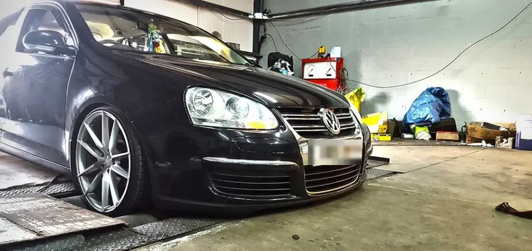 Black Volkswagen Golf on the rolling road
