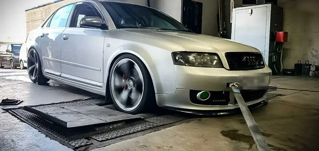 Silver Audi A4 strapped down on the 4WD dyno